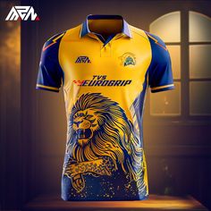 a yellow and blue rugby shirt with a lion on the front, sitting on a table