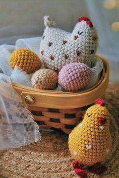 three crocheted chickens sitting in a basket