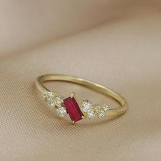 Unique Art deco Pink Ruby  ring.Handmade for you from start to finish with each gemstone and diamond handpicked for maximum sparkle.This ring is great for stacking and could also be a unique engagement ring or an amazing gift for her!The diamonds are clustered together and sparkle vividly.Questions are most welcomeAll ring size available, if you cannot find your ring size please contact us- Made to Order, perfectly finished, Fast shipping fully insured and traceable online.- Ruby info: 5 x 2.5 m Fine Jewelry Ruby Diamond Ring For Promise, Fine Jewelry Diamond Birthstone Crystal Ring, Dazzling Ruby Ring With Prong Setting For Promise, Dazzling Ruby Promise Ring With Prong Setting, Fine Jewelry Crystal Birthstone Ring With Diamonds, Elegant Cluster Birthstone Rings, Elegant Birthstone Cluster Rings, Dainty Diamond Birthstone Ring For Proposal, Diamond Crystal Promise Ring With Gemstone