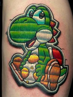 an image of a cartoon character tattoo on the thigh or leg for someone who likes to play video games