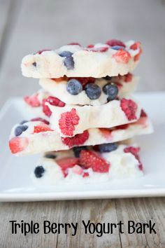 triple berry yogurt bark on a white plate