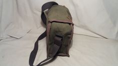 Vintage 1980's military green canvas bag - shoulder bag - NEW. Measurements: H - 10'' [ 25cm.] W - 10'' [ 25cm.] Side - 5'' [ 12.5cm.] One section and one pocket inside. Leather clasps.Adjustable canvas long handle - max.39 2/5'' [100cm.] UNUSED. NOTE: All vintage items in my shop that are used have been restored according to the possibilities All defects are removed,except the normal signs of use over the years. Thank you and successful shopping. Khaki Canvas Satchel Bag, Canvas Flap Shoulder Bag For School, Canvas Satchel In Khaki For School, Vintage Green Canvas Bag For Travel, Khaki Canvas School Satchel, Military Style Satchel Bag For Daily Use, Green Canvas Satchel With Adjustable Strap, Green Satchel Shoulder Bag For Outdoor, Green Crossbody Satchel For Outdoor