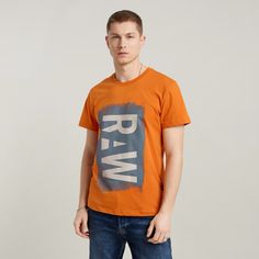 T-Shirt Painted Raw Graphic Is One Of Our Organic Cotton Graphic T-Shirts. This Straight Fit Version Features A Raw Print At The Front. Ribbed Neckline Straight Hem Graphic Raw Print At The Front Graphic Print At The Front G-Star Originals Label At The Lower Side Seam Sizing: Regular Fit Round Neck Short Sleeves Orange Top With Letter Print And Relaxed Fit, Casual Orange Tops With Letter Print, Casual Orange Tops With Graphic Print, Trendy Orange Tops With Text Print, Casual Orange Top With Graphic Print, Casual Orange Tops With Screen Print, Casual Orange Shirt With Screen Print, Casual Orange Shirt With Letter Print, Casual Orange Crew Neck Top