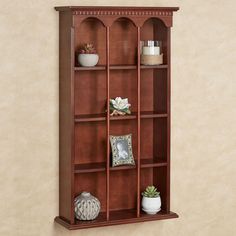 PRICES MAY VARY. Four shelves, 17 Inch Wx5 Inch Dx7.5 Inch H each, display your treasures Finished in a beautiful classic cherry Wooden wall curio has traditional styling Unique vertical design with arches and dentil molding Measures 20 Inch Wx7 Inch Dx36 Inch H and weighs 20 lbs. Graceful arches and fine dentil molding highlight the MacKenzie Classic Cherry Vertical Wall Curio Shelf. The wooden furnishing is finished in classic cherry and features four shelves, 17 Wx5 Dx7.5 H each, to display y Curio Shelves, Curio Wall, Dentil Molding, Curio Display, Dentil Moulding, Curio Shelf, Living Room Foyer, Traditional Style Decor, Decorating Shelves