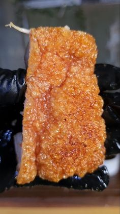 a piece of fried food sitting on top of a table