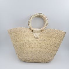 Meet you new summer bag. This large woven farmers market bag with handle is perfect to take to beach or to market. Its versatile and trendy. Measures 21" x 13" Add pompom and make it unique. ( Pompom shown in this picture is just sample not included with bag.) Handmade in Mexico. Basket Beach Bag Made Of Natural Fiber For Vacation, Bohemian Straw Bag For Vacation Shopping, Chic Market Straw Tote Bag, Chic Straw Tote Bag For Market, Bohemian Beach Bag In Natural Fiber For Vacation, Eco-friendly Woven Cream Beach Bag, Bohemian Straw Bag For Beach Season Shopping, Eco-friendly Cream Woven Beach Bag, Bohemian Natural Fiber Beach Bag For Vacation