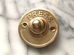 an antique brass door knob with the word proboss on it's center