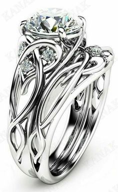 a white gold engagement ring set with an intricate design