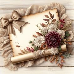 an old paper with flowers on it and a ribbon around the edge is laying on a wooden surface