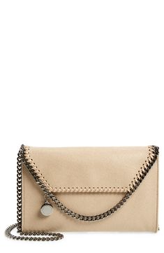 A gleaming diamond-cut chain outlines the whipstitched flap and serves as the strap of a compact crossbody bag in Stella McCartney's high-quality faux leather. A logo-jacquard lining made using recycled plastic bottles means it's responsibly crafted inside and out. Style Name:Stella Mccartney Mini Falabella Shaggy Dear Faux Leather Crossbody Bag. Style Number: 5911913. Available in stores. Chic Beige Wallet On Chain With Chain Strap, Beige Evening Wallet On Chain With Chain Strap, Leather Crossbody Wallet With Magnetic Closure, Beige Wallet On Chain For Everyday Use, Beige Wallet On Chain For Evening, Beige Wallet On Chain With Chain Strap For Evening, Beige Leather Evening Wallet On Chain, Beige Leather Wallet On Chain For Evening, Evening Leather Wallet On Chain In Beige