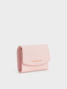 This product is made with at least 20% sustainable materials by weight. CHARLES & KEITH uses recycled, degradable, organic, and water-based materials in our eco-conscious collection. If you love pastels, you are certain to love this small wallet in a gorgeous, light pink. The caviar finish makes this piece incredibly durable, even with daily use. In addition to its compartmentalised interior that will easily hold your cash, cards and coins, it also comes with a rear patch pocket that can house loose change and other small items. Charles And Keith Wallet, Loose Change, Charles Keith, Wallet Card, Small Wallet, Eco Conscious, Sustainable Materials, Kids Gifts, Small Items