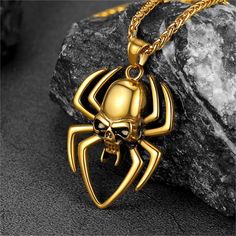 Nice Looking Skull Spider Necklace, Cool and Masculine, the perfect accessory for Halloween. This men's skull necklace is made of 316L stainless steel, high quality and hypoallergenic. The skull pendant is an ideal gift for men, father, husband, boyfriend, friends on birthday, anniversaries, valentine's day, Halloween, father's day.   SPU:  PSP40006  Collection:  Gothic  Material: Stainless Steel  Weight: 35.7  Chain Length: 55cm-60cm(22''-24'')/Resizable  Pendant Size: 55.7mm*37.4mm  Clean it w Gold Punk Necklace For Halloween, Punk Gold Stainless Steel Jewelry, Gold Skull Necklace For Halloween, Punk Skull Necklace In Stainless Steel, Punk Skull Shaped Stainless Steel Necklace, Punk Skull Stainless Steel Necklace, Halloween Stainless Steel Jewelry With Skull Print, Halloween Skull Print Stainless Steel Jewelry, Halloween Stainless Steel Skull Print Jewelry