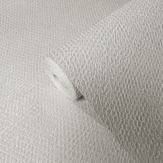 a close up view of a beige textured fabric