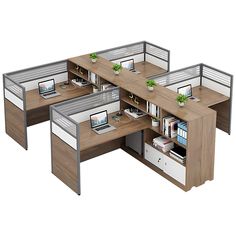 an office cubicle with three desks and one computer on the other side is shown