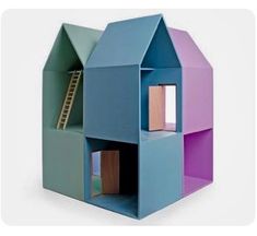 a toy house made out of colored cardboard