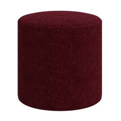 a large red ottoman sitting on top of a white floor