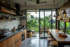 an open kitchen and dining area with sliding glass doors