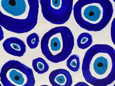 an abstract painting with blue and white circles