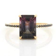 This Watermelon Tourmaline & Black Diamond Raven Ring is the perfect balance of mystery and elegance. Skillfully handcrafted, the unique tourmaline gem features a stunning gradation of colors that is modern and chic. Add this beautiful piece to your jewelry collection and stand out with its mesmerizing beauty. This Elegant Faceted Tourmaline Ring, Raven Ring, Mesmerizing Beauty, Colored Gemstones, Diamond Jewel, Dope Jewelry, Jewelry Boards, Wishing Well, Jewelry Brand