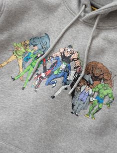 the hoodie has an image of several cartoon characters on it