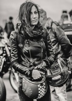 black and white photograph of a woman on a motorbike wearing a leather jacket