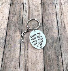 a keychain that says enjoy the hunt but find your way back to hell