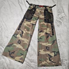 Rare vintage Tripp NYC  Size S-M Mesh pockets, mesh skull detail, adjustable waist, low rise, wide leg fit Great condition  Measurements: length 95 cm, waist 40 cm, hips 55 cm Vintage Tripp Nyc, Tripp Nyc Pants, Womens Trousers, Tripp Nyc, Womens Pants, Trousers Women, Low Rise, Camouflage, Capri Pants