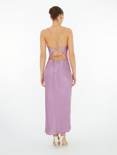 The Riviera in sweet Lavender Violet. Featuring a cowl neck with lace up back detailing, in 100% silky soft recycled fabric. Enjoy. Spring Satin Slip Dress With Back Opening, Spring Backless Slip Dress With Lace-up Back, Spring Slip Dress With Bias Cut And Cowl Back, Spring Purple Dress With Corset Back, Purple Spring Dresses With Corset Back, Cowl Back Slip Dress For Night Out In Spring, Spring Slip Dress With Cowl Back For Night Out, Spring Cowl Back Slip Dress For Night Out, Spring Evening Ruched Back Slip Dress