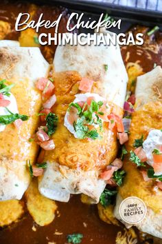 baked chicken enchiladas with cilantro and sour cream in a casserole dish