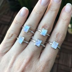 "A simple stackable rectangle-shaped smooth(cabochon)Rainbow Moonstone bezel set on a sterling silver ring, which makes a great birthstone ring for those June Birthdays or a lovely midi/pinky/knuckle ring for her! This also makes an ideal ring to stack with our other gemstone rings. BELESAS and 925 hallmarked inside the ring. Wrapped in a box ready for gift giving.(r-496) Listing is for 1 Ring Ring info -------------------------- Rainbow Moonstone measure 6.5mm x 8.5mm Model is wearing a size 5 Minimalist Stackable Rings With Rectangular Stone, Stackable Rectangular Sterling Silver Jewelry, Sterling Silver Stackable Rectangular Jewelry, Minimalist Silver Rings With Rectangular Stone, Modern Stackable Moonstone Ring For Gift, Modern Stackable Moonstone Ring Gift, Adjustable Minimalist Jewelry With Rectangular Stone, Silver Minimalist Stackable Moonstone Ring, Minimalist Jewelry With Rectangular Birthstone