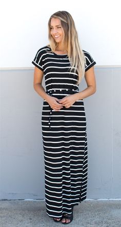 Looking for the perfect dress to transition from summer to fall? Look no further than our Cuffed Sleeve Striped Maxi Dress! This stunning dress features cuffed sleeves and a waist tie that add just the right amount of detail to make it stand out from the crowd. Available in Small, Medium, Large, and XLarge sizes, this dress is sure to flatter any figure. Our model, standing at 5'6", is wearing a size small, but with the adjustable waist tie, you can customize the fit to your liking. Plus, with a Casual Striped Maxi Dress For Work, Spring Black Maxi Dress With Tie Waist, Casual Spring Dress With Banded Waist, Casual Spring Dresses With Banded Waist, Casual Dress With Banded Waist For Spring, Black Belted Maxi Dress For Summer, Summer Black Belted Midi Dress, Casual Fitted Maxi Dress With Tie Waist, Casual Midi Dress With Tie Waist For Day Out