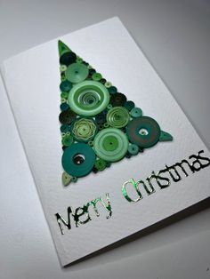 a christmas card with green buttons and the words merry christmas