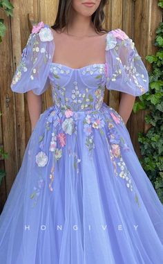 Prom Ball Gown With Floral Embroidery And Fitted Bodice, Floral Embroidery Ball Gown For Debutante Ball, Elegant Ball Gown With Floral Appliqué And Sweetheart Neckline, Elegant Ball Gown With Floral Applique And Sweetheart Neckline, Purple Gown For Debutante Ball In Spring, Lavender Ball Gown With Fitted Bodice, Lavender Tulle Dress With Fitted Bodice, Spring Debutante Ball Gown With Sweetheart Neckline, Sweetheart Neckline Ball Gown With Floral Applique For Wedding