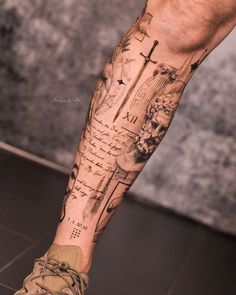 a man's leg with a cross on it and words all over the side