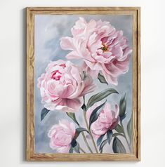 a painting of pink flowers in a wooden frame