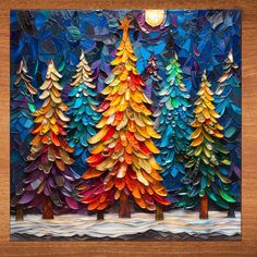 an art work with paper cut trees on it