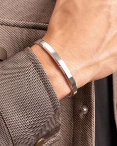 The cousin to our Classic Cuff. Embellished with tapered edges for a comfortable fit, incredible detail, and extra light-catching ability. The silver Avenue Cuff was made with simplicity in mind, so you can wear it every day to the gym, office, and special occasions. JAXXON Silver Avenue Cuff Bracelet | Size Medium/Large Mens Silver Cuff Bracelet, Gym Office, Solid Gold Chains, Simple Bracelets, Silver Shop, Silver Cuff Bracelet, Men's Rings, Pendant Bracelet, Silver Cuff