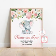 an elephant with flowers on it's head sits in front of a sign that says mom - osa bar