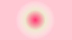 an image of a pink and white circle on a light pink background that is very blurry