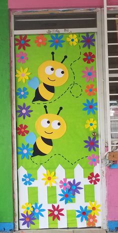 a door decorated with flowers and two bees