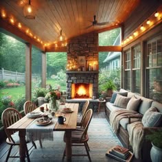 an outdoor living room with a fire place and table set for two on the patio