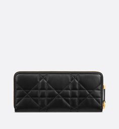 The Miss Caro Voyageur slim wallet features an elegant and practical design. Crafted in black lambskin, it is enhanced by a Macrocannage quilted effect and accented by an antique gold-finish metal CD signature on the front. The chic and spacious companion can accommodate daily essentials. It can be coordinated with other accessories from the same line and will fit into any bag.. Luxury Evening Wallets With Interior Card Slots, Luxury Evening Wallet With Interior Card Slots, Elegant Compact Leather Wallet, Luxury Evening Wallet With Leather Lining, Luxury Bifold Evening Wallet, Designer Leather Clutch With Card Slots, Designer Wallet With Removable Pouch For Formal Occasions, Designer Formal Wallet With Removable Pouch, Luxury Bifold Wallets With Removable Pouch