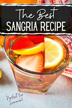 the best sangria recipe with sliced strawberries and lemons in a glass bowl