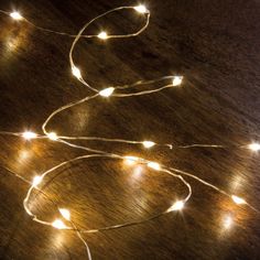 a string of lights on a wooden table