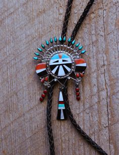 Offered is another intricate and dynamic Zuni bolo tie.   We've been researching this artist for some time and have yet to identify the maker.  Extraordinary design and silver-work as well as the finest materials always set this artist's work apart. We're excited to continue our research in hope's of giving credit to such an amazing early Zuni artist.  This example is just beautiful. We include a side by side image of another separately listed piece by this artist.  We think they're incredible. Handmade Sterling Silver Bolo Tie As Gift, Unique Silver Bolo Tie As A Gift, Handmade Bolo Ties As Unique Gifts, Unique Silver Bolo Tie For Gift, Unique Silver Bolo Ties As Gift, Unique Silver Bolo Ties For Gift, Unique Handmade Lariat Bolo Ties, Navajo Silver Jewelry, Vintage Navajo Jewelry