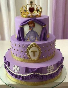 a purple and gold cake with a princess on top