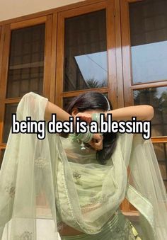 a woman with her arms behind her head and the words being desi is a blessing