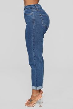 It's all jean-etics. Made from a Cotton-Lycra blend and cut into a high-rise design, our I Got It From My Mama Jeans will give you the on-trend Mom Jean look with an added stretch for comfort and mobility. Available In Medium Wash, Black, Dark Denim, And Light Blue Wash 12" Rise - Super High Rise Mom Jean 5 Pocket 28" Unrolled Inseam 25" Rolled Inseam Disclaimer: Due To The Specialized Wash Process, Each Garment Is Unique 99% Cotton 1% Spandex Available In Plus Sizes Imported | I Got It From My Straight Denim Bottoms For Spring, Denim Blue Mom Fit Bottoms For Spring, Spring Denim Blue Mom Fit Bottoms, Trendy Mom Fit Cropped Bottoms, Trendy Mom Fit Cropped Leg Bottoms, Trendy Cropped Leg Mom Fit Bottoms, High Rise Non-stretch Cropped Denim Jeans, Mom Fit Denim Pants With Straight Leg, Mid-rise Medium Wash Mom Jeans