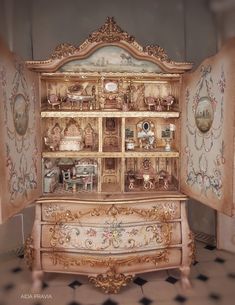 an antique china cabinet with many items on it