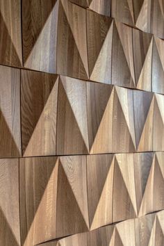 a wooden wall with many different shapes and sizes